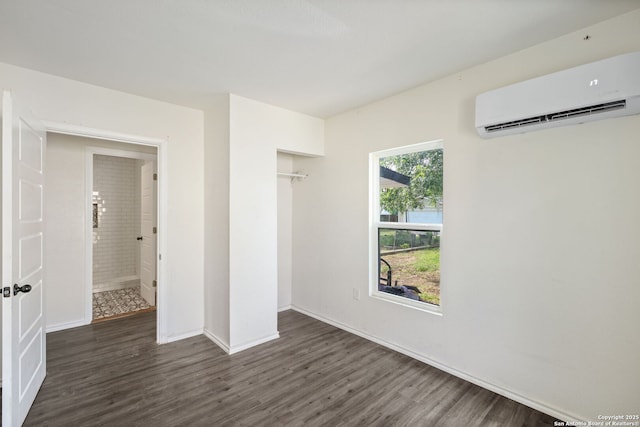 211 Sylvia, San Antonio, TX 78237 - empty room featuring a wall mounted air conditioner and wood finished floors