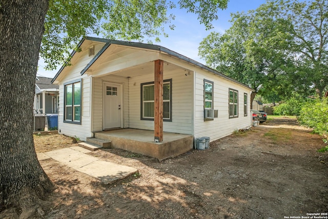211 Sylvia, San Antonio, TX 78237 - shotgun-style home with cooling unit and a porch