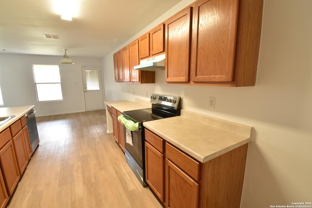 1510 June Berry, San Antonio, TX 78260 - kitchen featuring stainless steel appliances, under cabinet range hood, and brown cabinetry