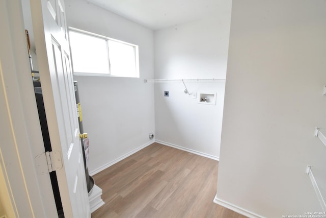 1510 June Berry, San Antonio, TX 78260 - laundry room with hookup for an electric dryer, hookup for a washing machine, and light wood-type flooring