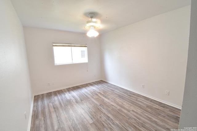 1510 June Berry, San Antonio, TX 78260 - spare room with wood finished floors and baseboards