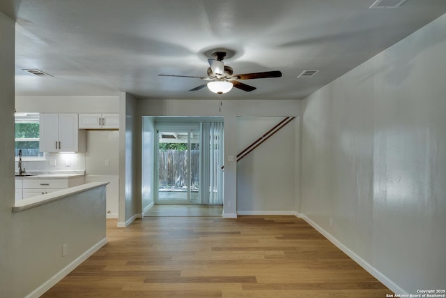 8302 Hastings, San Antonio, TX 78239 - unfurnished dining area with a ceiling fan, light wood-type flooring, and plenty of natural light