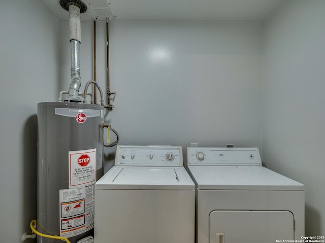 8302 Hastings, San Antonio, TX 78239 - laundry area with gas water heater and washer and clothes dryer