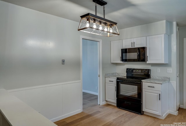 8302 Hastings, San Antonio, TX 78239 - kitchen featuring black appliances, white cabinets, light wood finished floors, and light countertops