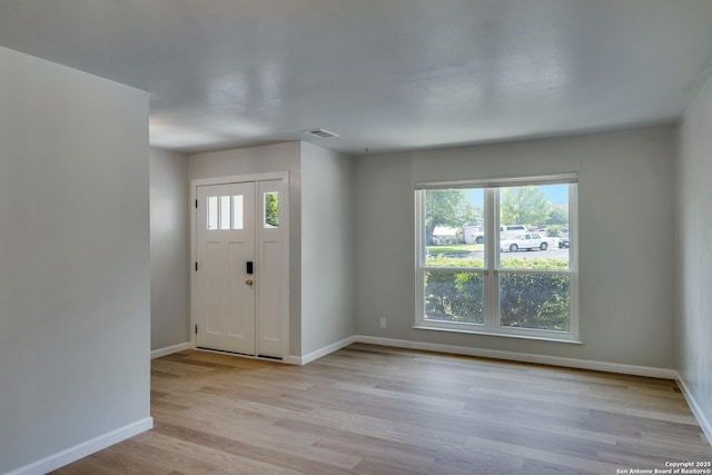 8302 Hastings, San Antonio, TX 78239 - foyer entrance with light wood-style floors and baseboards