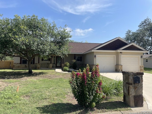 812 33rd St, Hondo, TX 78861 - ranch-style house with stone siding, a garage, concrete driveway, and stucco siding