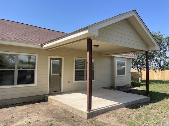 812 33rd St, Hondo, TX 78861 - rear view of house featuring a patio area and roof with shingles