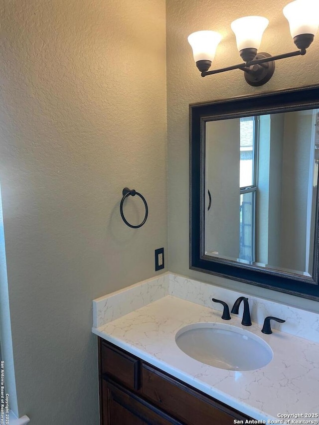 812 33rd St, Hondo, TX 78861 - bathroom with vanity and a textured wall