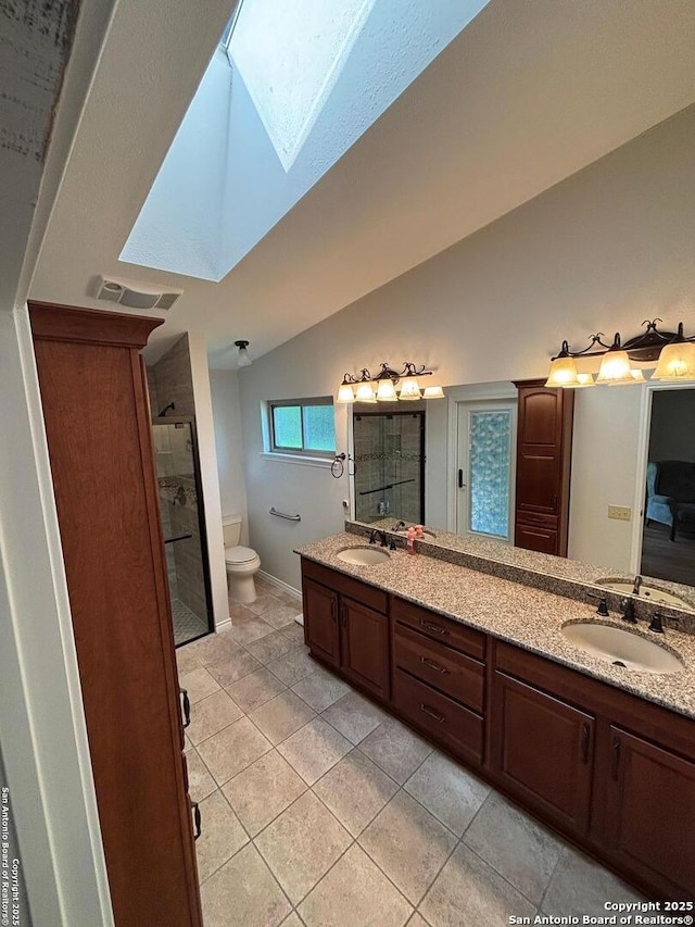 3716 Scenic Dr, Schertz, TX 78108 - full bathroom with a skylight, a stall shower, double vanity, lofted ceiling, and tile patterned flooring