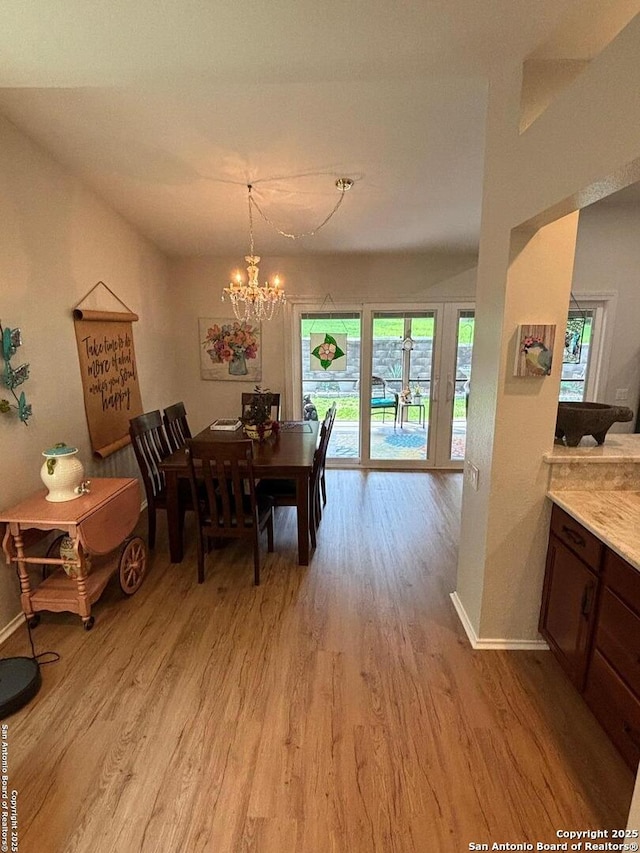 3716 Scenic Dr, Schertz, TX 78108 - dining area featuring light wood-style flooring and a chandelier