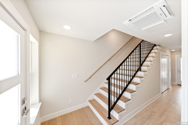 419 Ira Ave Unit 1101, San Antonio, TX 78209 - stairway with wood finished floors and recessed lighting
