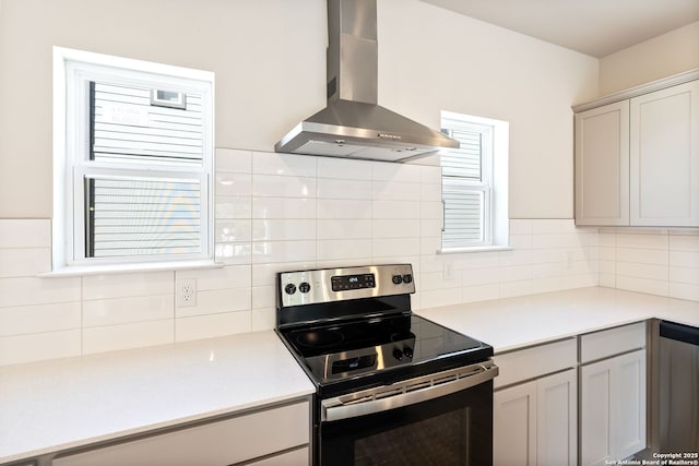 419 Ira Ave Unit 1101, San Antonio, TX 78209 - kitchen with stainless steel appliances, wall chimney range hood, backsplash, and light countertops