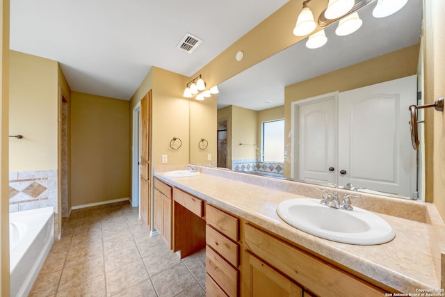 312 Bunker Hl, Pleasanton, TX 78064 - bathroom with double vanity, tile patterned flooring, and a bath