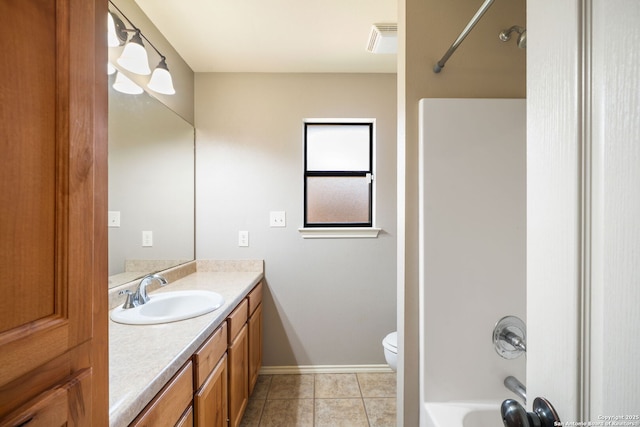 312 Bunker Hl, Pleasanton, TX 78064 - bathroom featuring vanity, tile patterned floors, and tub / shower combination