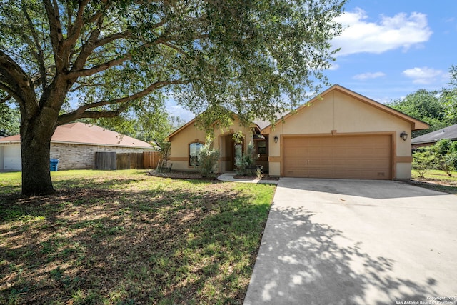 312 Bunker Hl, Pleasanton, TX 78064 - view of front of house featuring stucco siding, an attached garage, and driveway