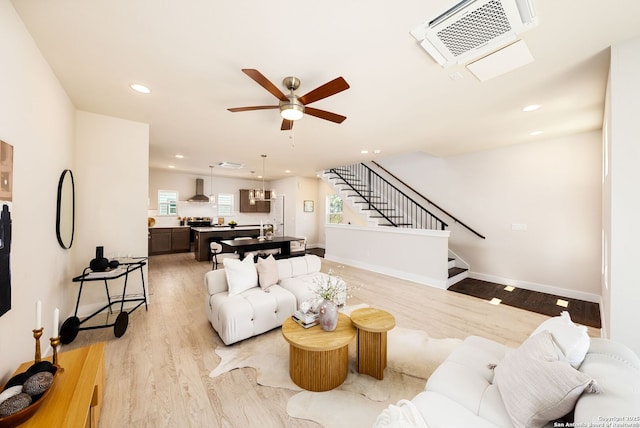 419 Ira Ave Unit 1102, San Antonio, TX 78209 - living room featuring ceiling fan, stairway, light wood-style floors, and recessed lighting