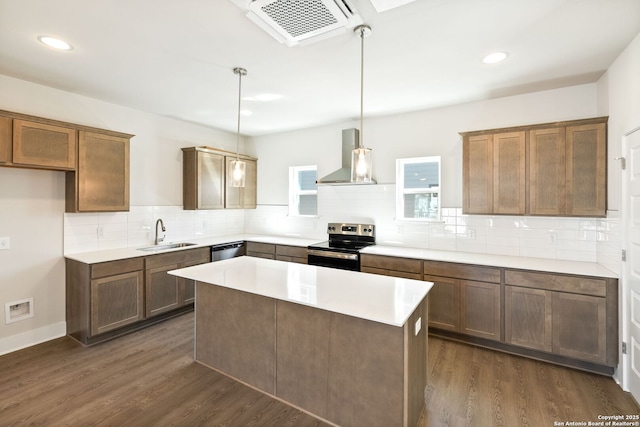 419 Ira Ave Unit 2101, San Antonio, TX 78209 - kitchen featuring stainless steel appliances, wall chimney range hood, dark wood finished floors, tasteful backsplash, and a kitchen island