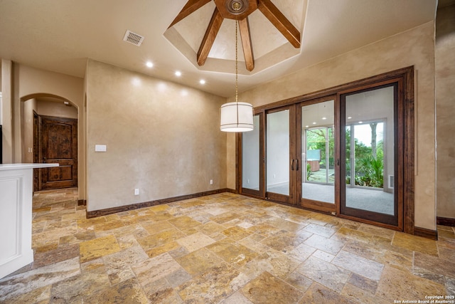 1437 Decanter, New Braunfels, TX 78132 - unfurnished dining area with stone tile floors, arched walkways, recessed lighting, and a high ceiling