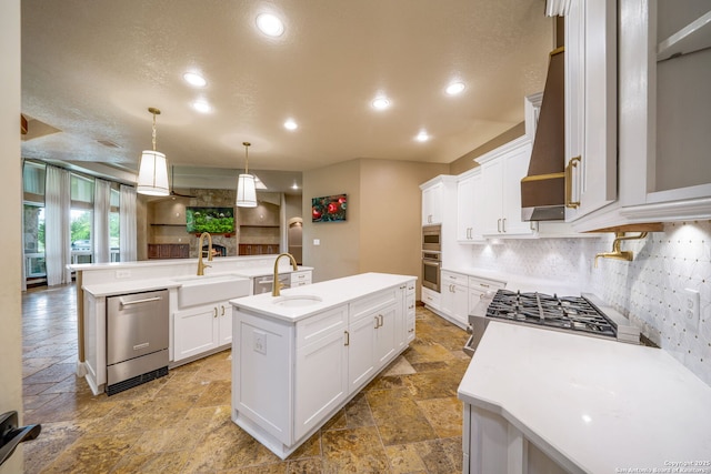 1437 Decanter, New Braunfels, TX 78132 - kitchen with stone tile flooring, a center island with sink, appliances with stainless steel finishes, backsplash, and light countertops