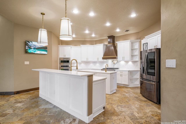 1437 Decanter, New Braunfels, TX 78132 - kitchen with stainless steel appliances, custom range hood, open shelves, a center island with sink, and light stone finish floors