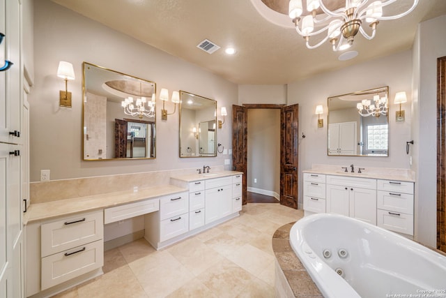 1437 Decanter, New Braunfels, TX 78132 - bathroom featuring a chandelier, a tub with jets, two vanities, and recessed lighting