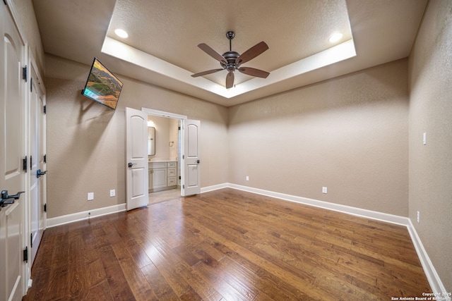 1437 Decanter, New Braunfels, TX 78132 - spare room with a raised ceiling, ceiling fan, wood-type flooring, recessed lighting, and a textured wall