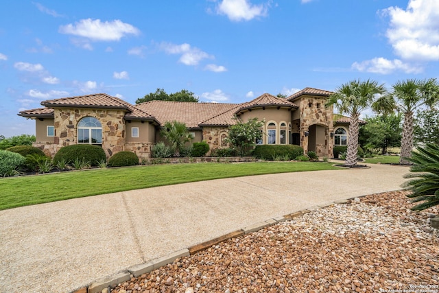 1437 Decanter, New Braunfels, TX 78132 - mediterranean / spanish house featuring stone siding, a tile roof, and stucco siding