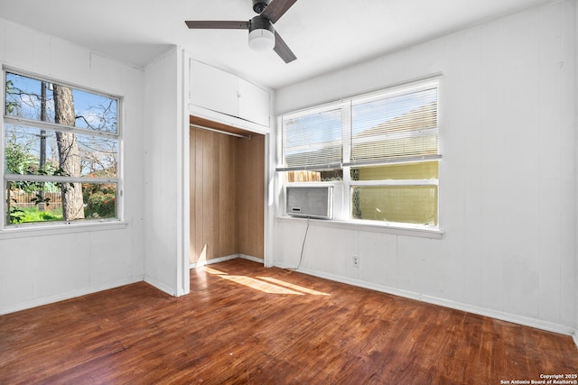 231 Craigmont, San Antonio, TX 78213 - unfurnished bedroom featuring wood finished floors, a closet, multiple windows, and a ceiling fan