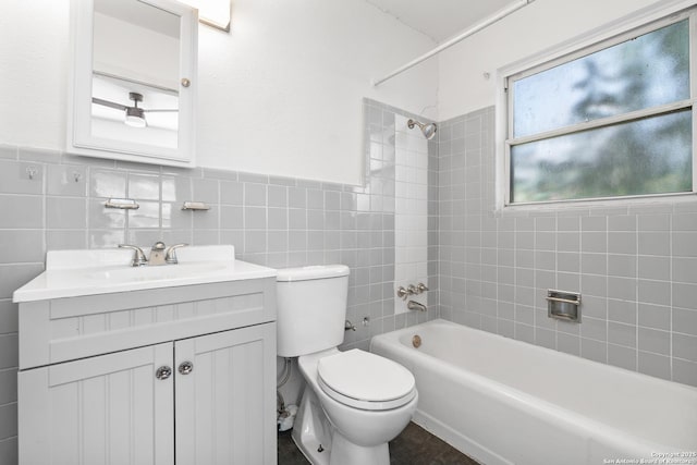 231 Craigmont, San Antonio, TX 78213 - full bathroom featuring vanity, bathtub / shower combination, tile walls, and a wainscoted wall