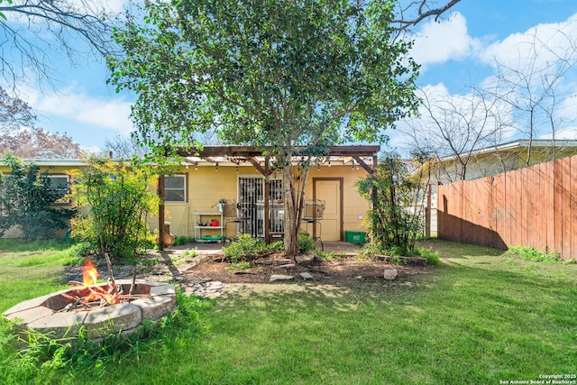 231 Craigmont, San Antonio, TX 78213 - back of property featuring an outdoor fire pit
