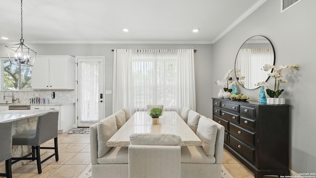 212 Wentworth, Spring Branch, TX 78070 - dining space with light tile patterned floors, a chandelier, crown molding, and recessed lighting