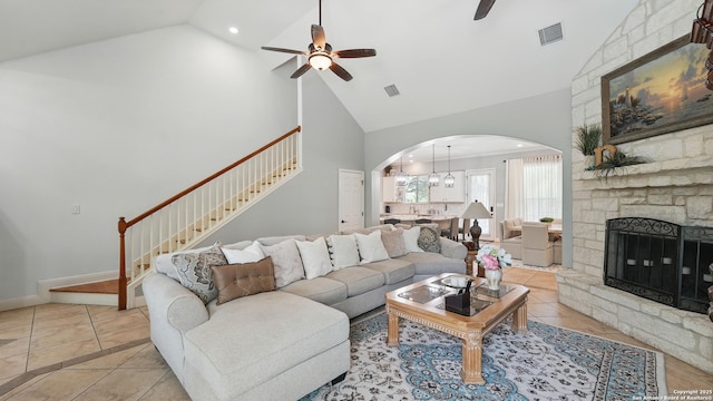 212 Wentworth, Spring Branch, TX 78070 - living room featuring a ceiling fan, high vaulted ceiling, arched walkways, stairway, and light tile patterned floors