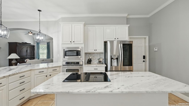 212 Wentworth, Spring Branch, TX 78070 - kitchen featuring appliances with stainless steel finishes, a chandelier, light tile patterned flooring, ornamental molding, and a center island