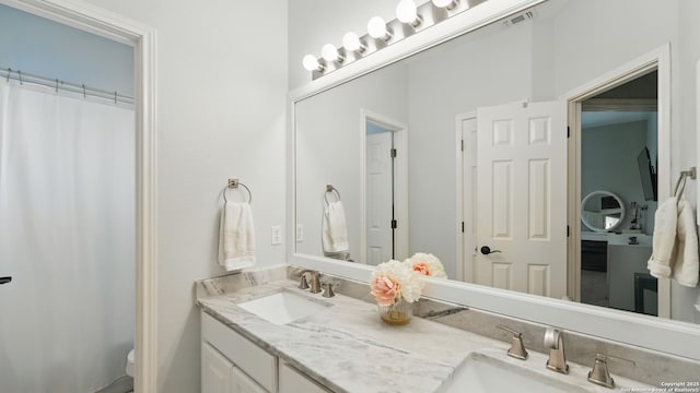 212 Wentworth, Spring Branch, TX 78070 - bathroom featuring double vanity and a shower with shower curtain