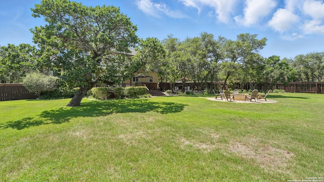 212 Wentworth, Spring Branch, TX 78070 - fenced yard with an outdoor fire pit and a deck