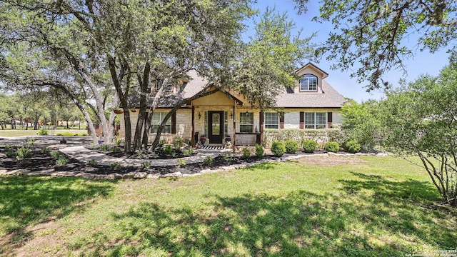 212 Wentworth, Spring Branch, TX 78070 - view of front of home with a front lawn and stone siding