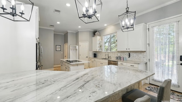 212 Wentworth, Spring Branch, TX 78070 - kitchen featuring a chandelier, stainless steel appliances, open shelves, recessed lighting, and crown molding