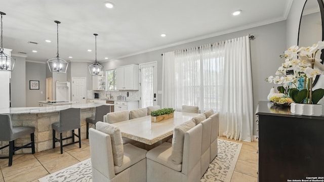 212 Wentworth, Spring Branch, TX 78070 - dining space with light tile patterned floors, ornamental molding, recessed lighting, and a chandelier