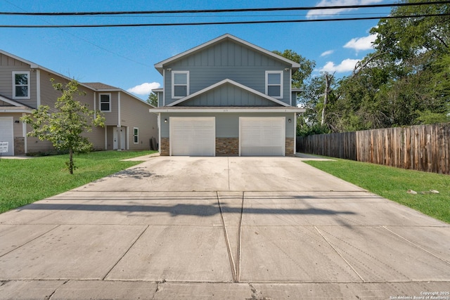 315 Bundy, San Antonio, TX 78220 - traditional-style house with stone siding, driveway, board and batten siding, and an attached garage