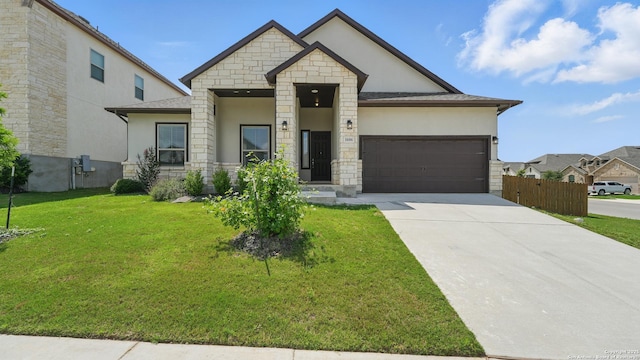 1606 Folk Victorian, New Braunfels, TX 78132 - view of front of house with stucco siding, an attached garage, driveway, and stone siding