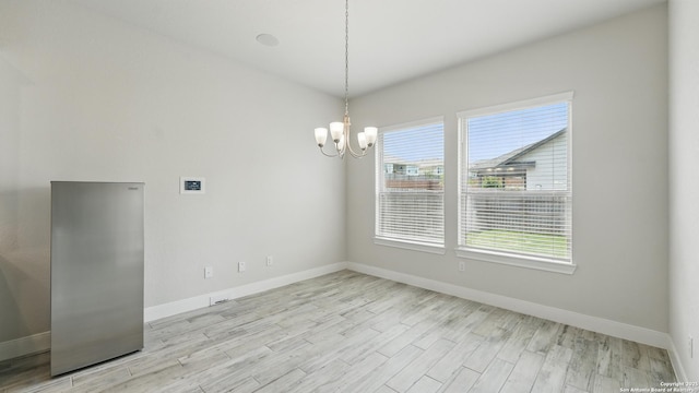 1606 Folk Victorian, New Braunfels, TX 78132 - unfurnished dining area featuring a chandelier and light wood-style floors