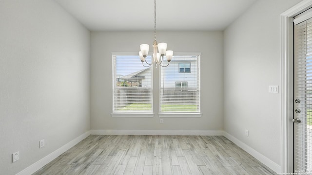 1606 Folk Victorian, New Braunfels, TX 78132 - unfurnished dining area featuring a chandelier and light wood-style flooring