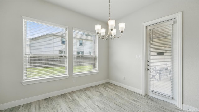 1606 Folk Victorian, New Braunfels, TX 78132 - unfurnished dining area with a chandelier, plenty of natural light, and wood finished floors