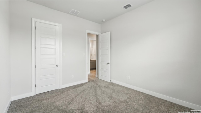 1606 Folk Victorian, New Braunfels, TX 78132 - unfurnished bedroom featuring carpet floors and baseboards