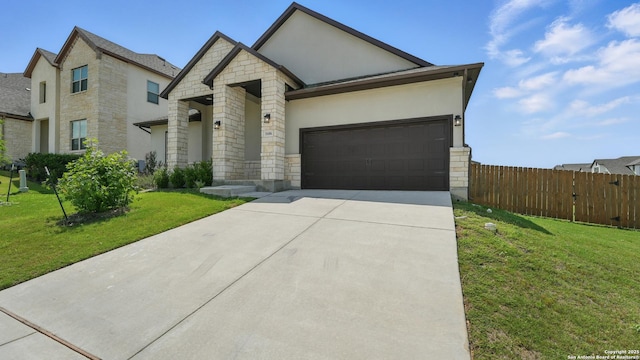 1606 Folk Victorian, New Braunfels, TX 78132 - view of front of home featuring stone siding, stucco siding, concrete driveway, and a garage