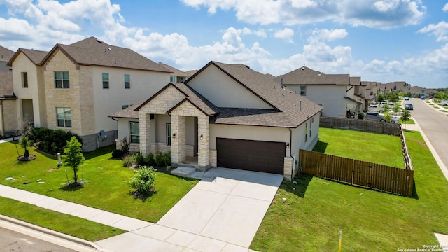 1606 Folk Victorian, New Braunfels, TX 78132 - view of front facade featuring a residential view, an attached garage, stone siding, concrete driveway, and stucco siding