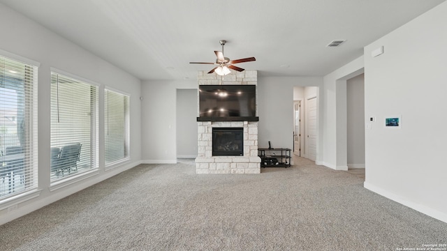 1606 Folk Victorian, New Braunfels, TX 78132 - unfurnished living room with plenty of natural light, a fireplace, ceiling fan, and carpet floors
