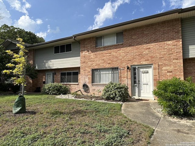 105 W Silver Sands Unit 105A, San Antonio, TX 78216 - view of property featuring a front yard and brick siding