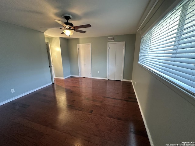 105 W Silver Sands Unit 105A, San Antonio, TX 78216 - unfurnished bedroom featuring wood finished floors and a ceiling fan