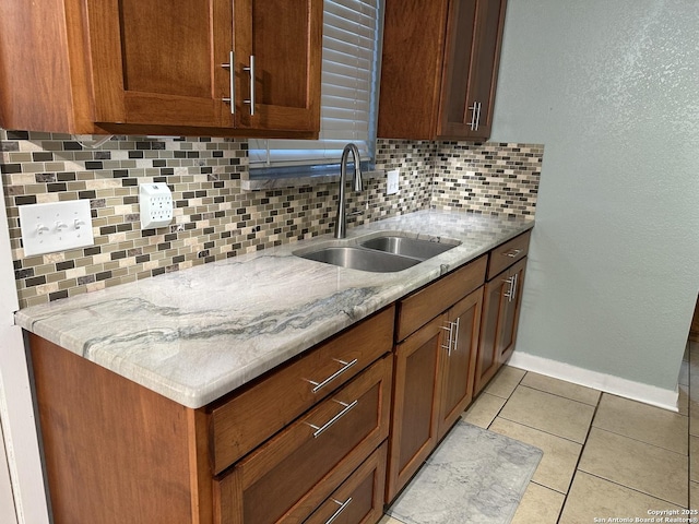 105 W Silver Sands Unit 105A, San Antonio, TX 78216 - kitchen featuring decorative backsplash, light tile patterned floors, and light stone countertops